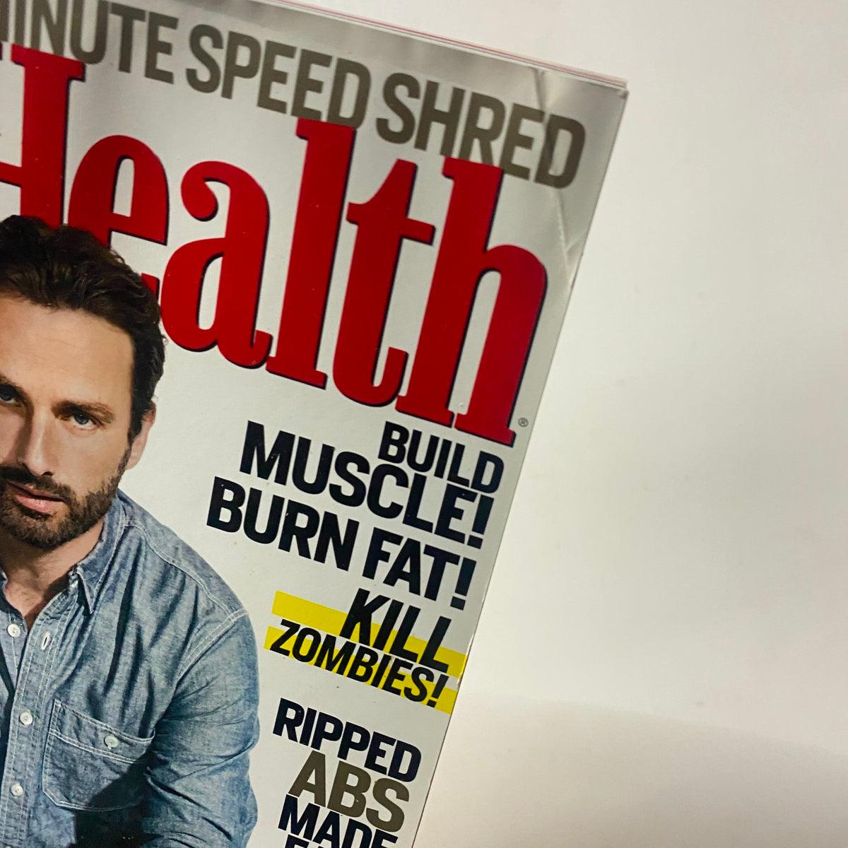 Cover of Men's Health Magazine, October 2012 featuring Andrew Lincoln, promoting fitness tips and highlighting The Walking Dead with phrases 'Build Muscle! Burn Fat! Kill Zombies!'