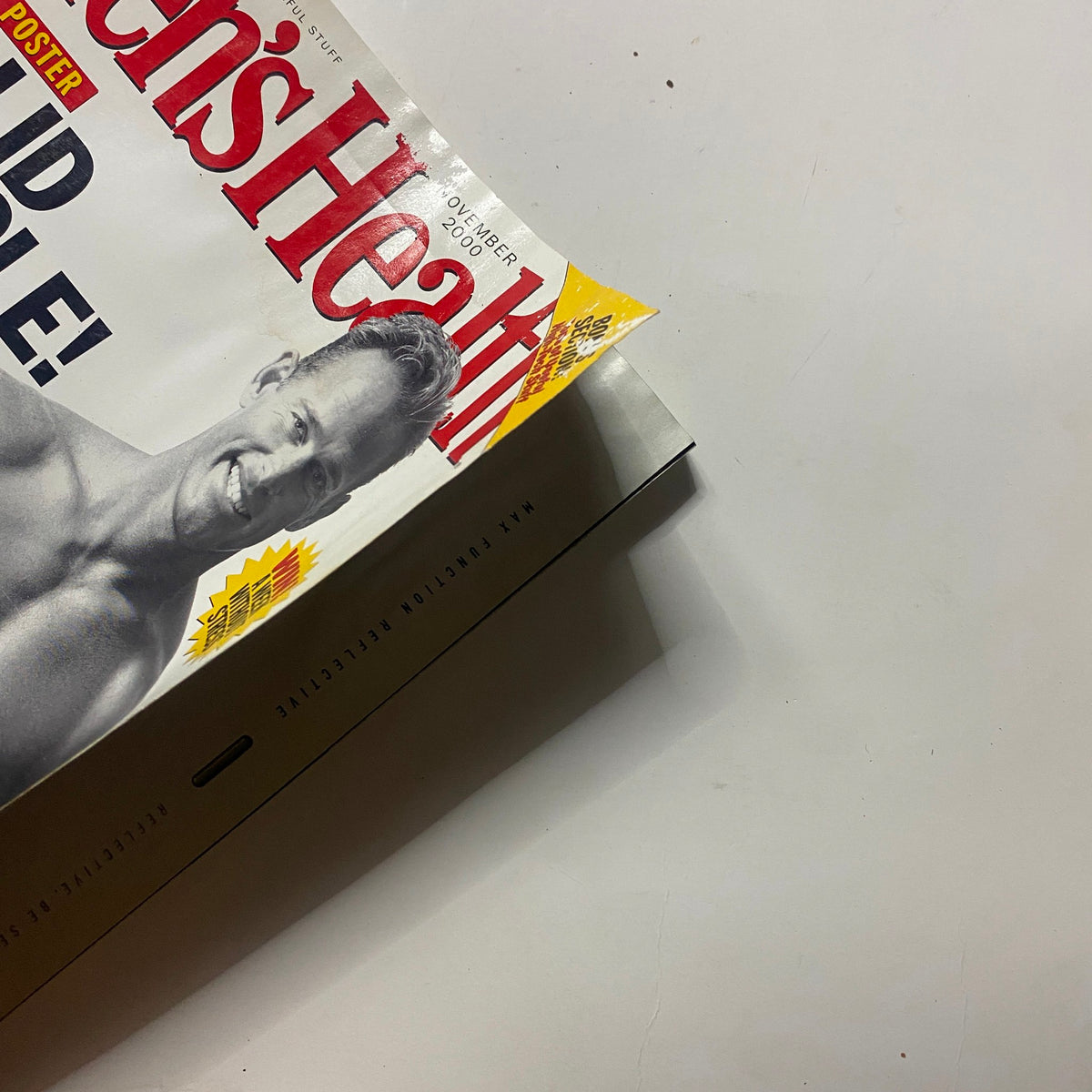 Close-up of Men's Health Magazine November 2000 cover with visible wear, showcasing the engaging design and fitness themes.