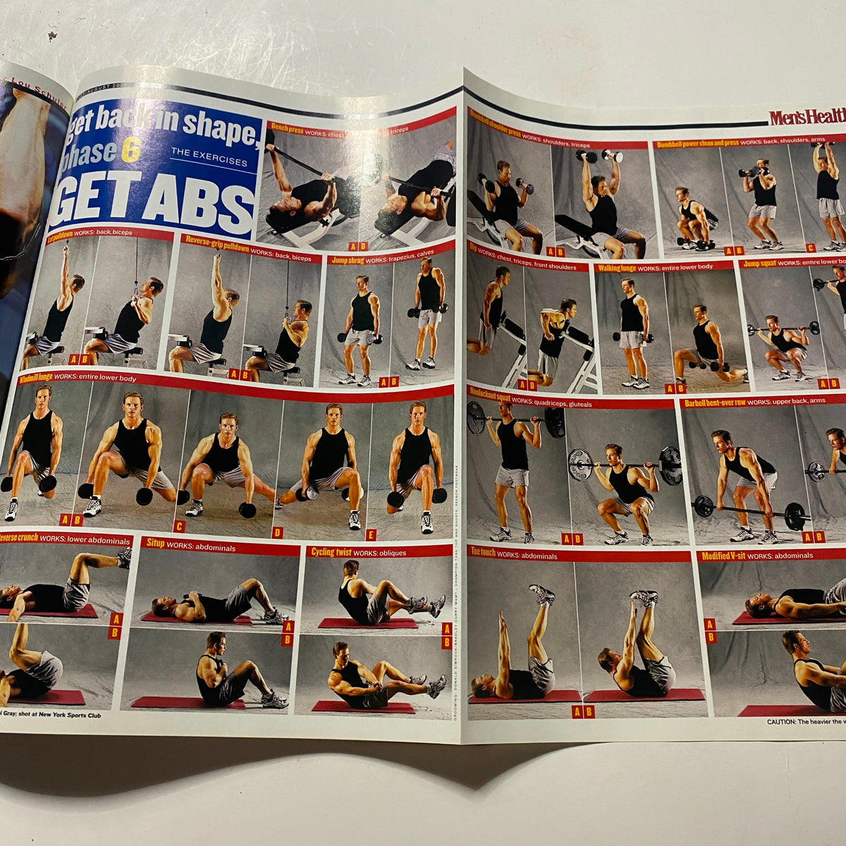 Interior page of Men's Health Magazine August 2001 showcasing various exercises and workout routines aimed at achieving abs, part of the fitness guide associated with 'The Hard Muscle Diet'.