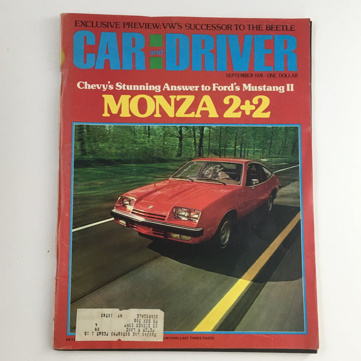 Front cover of Car and Driver Magazine, September 1974 edition, featuring the Ford Mustang II Monza 2+2 and showcasing a red Monza car on a tree-lined road.