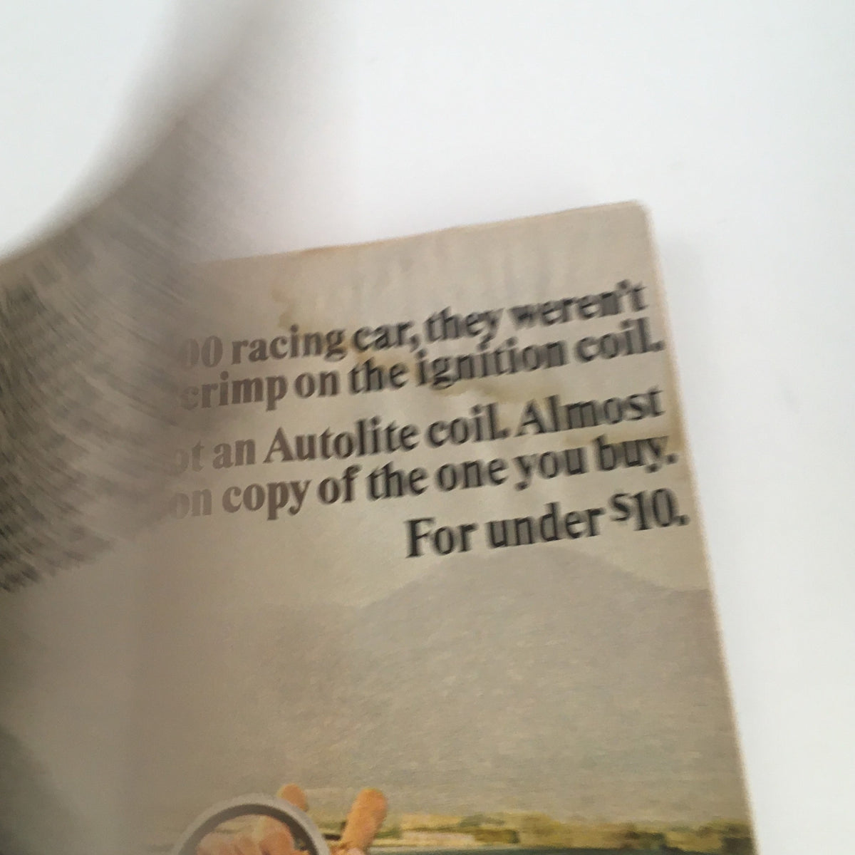 Inside page of Car and Driver Magazine July 1968, discussing automotive parts like ignition coils, paired with a vintage racing aesthetic.