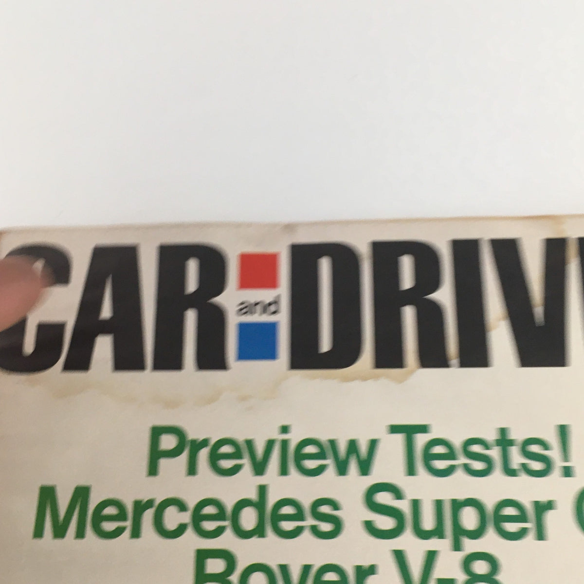 Close-up view of the Car and Driver Magazine headline, highlighting the Mercedes Super Car and Rover V-8 engine from June 1968.