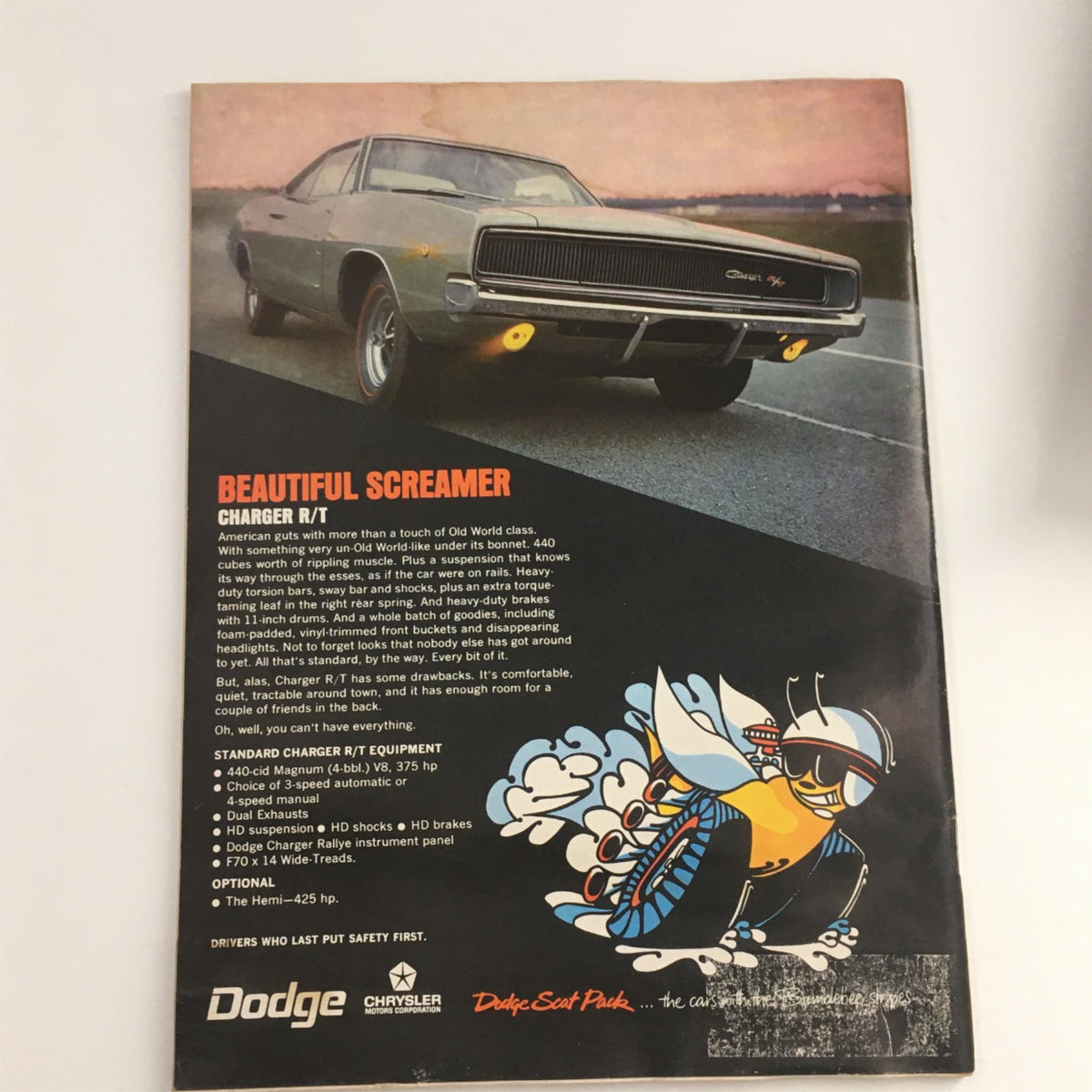 Back cover of Car and Driver Magazine June 1968 featuring a Dodge Charger R/T advertisement highlighting its performance features.