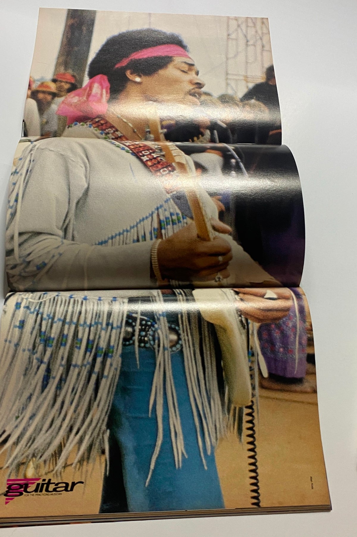 Guitar for the Practicing Musician Magazine April 1991 cover featuring Jimi Hendrix performing on stage with a unique outfit and guitar, showcasing a moment from his musical legacy.