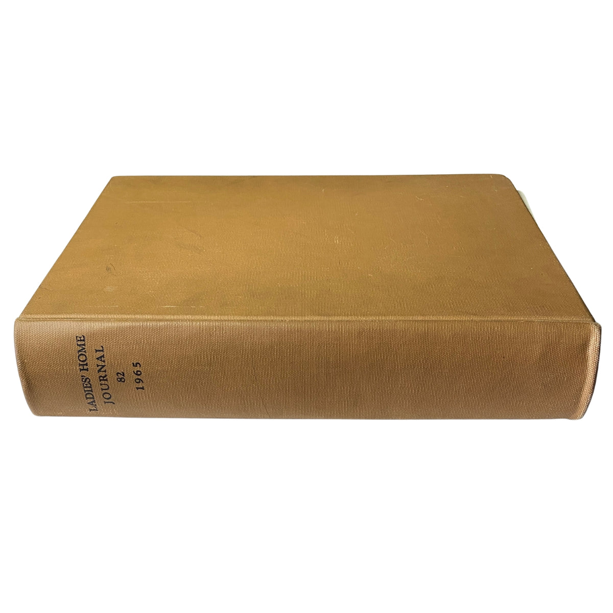 Side view of the 1965 Ladies' Home Journal Bound Magazine showing the spine with embossed text, ideal for vintage magazine collections.