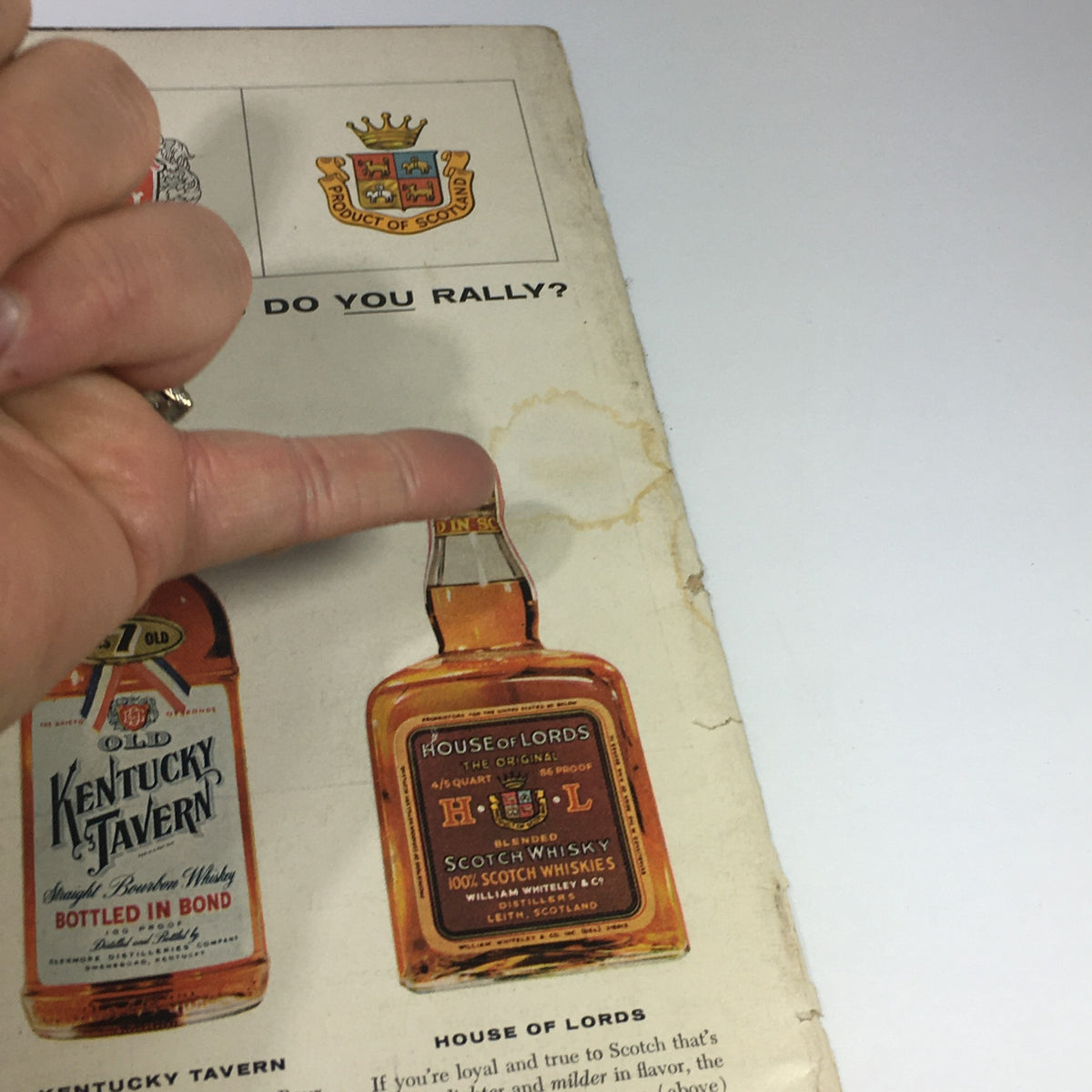 Back cover advertisement from Sports Illustrated magazine February 11, 1957, featuring whiskey brands and showcasing the magazine's vintage style.