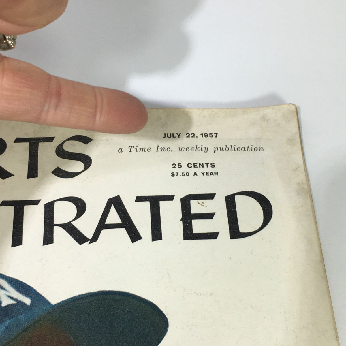 Detailed view of July 22, 1957 Sports Illustrated Magazine highlighting the publication date and pricing, featuring Yankees' Hank Bauer.
