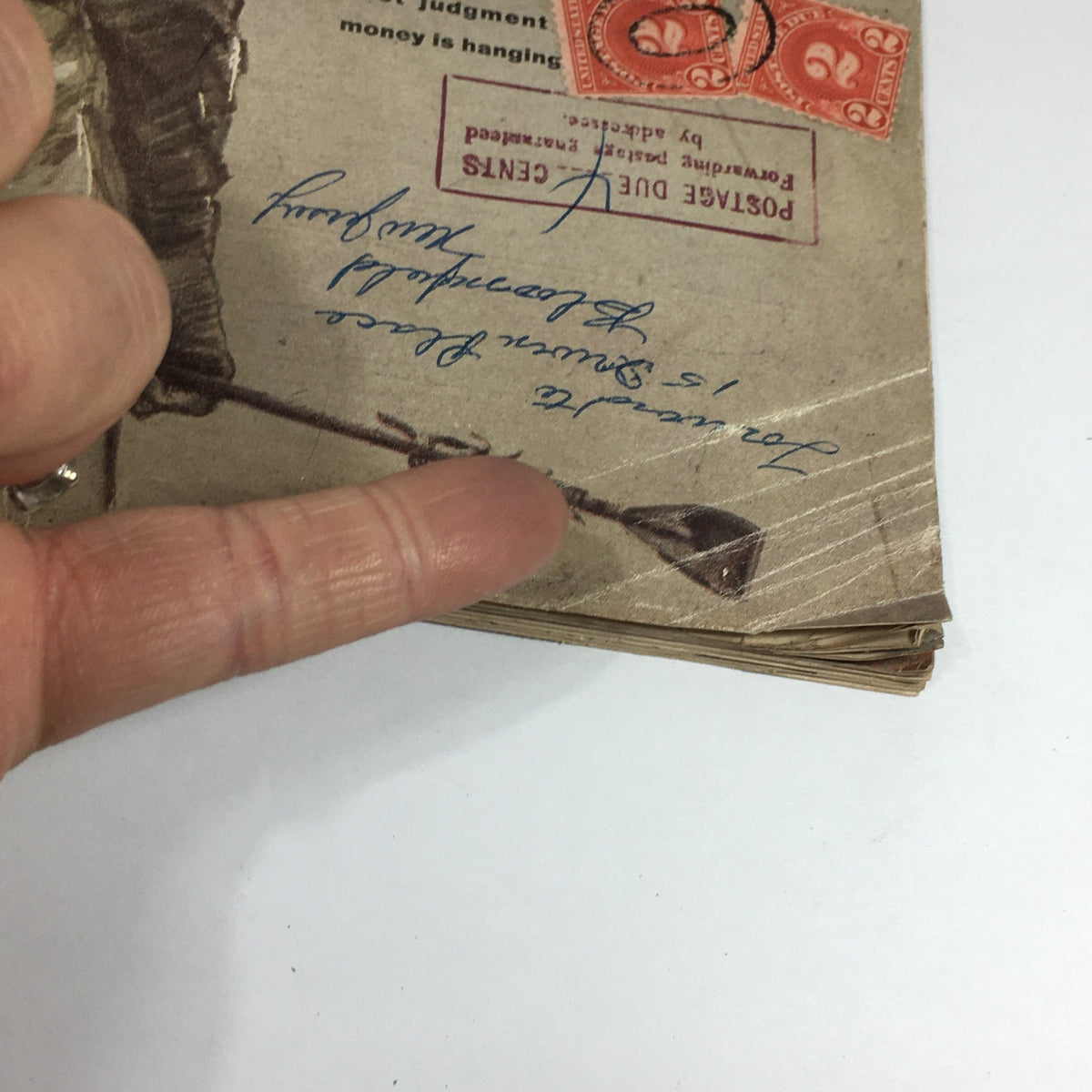 Close-up of the VTG Sports Illustrated Magazine from June 17, 1957, highlighting details of the cover, including the title 'The Art of Race Riding by Eddie Arcaro', vintage postage stamps, and handwritten notes.