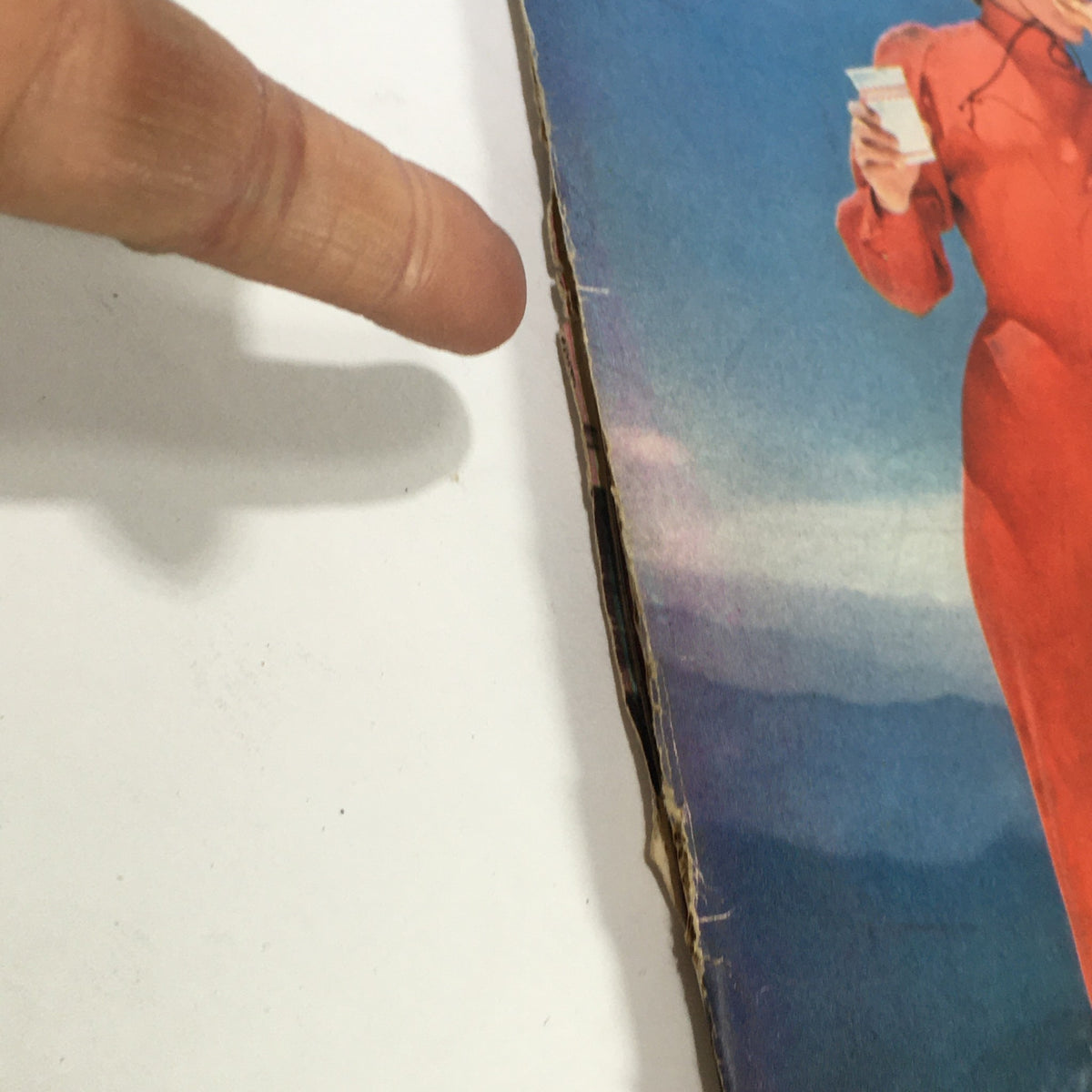 Close-up of Vintage Sports Illustrated Magazine cover from December 16, 1957, highlighting Amy Baird wearing ski attire against a mountain backdrop.