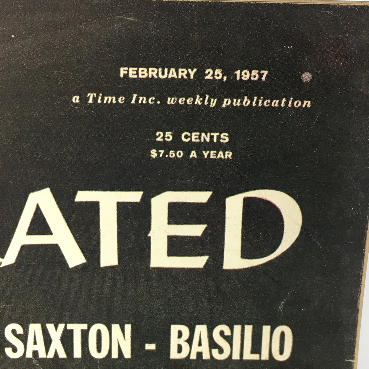 Close-up of the top portion of the VTG Sports Illustrated Magazine February 25, 1957 cover, highlighting the publication details and the matchup between Saxton and Basilio.
