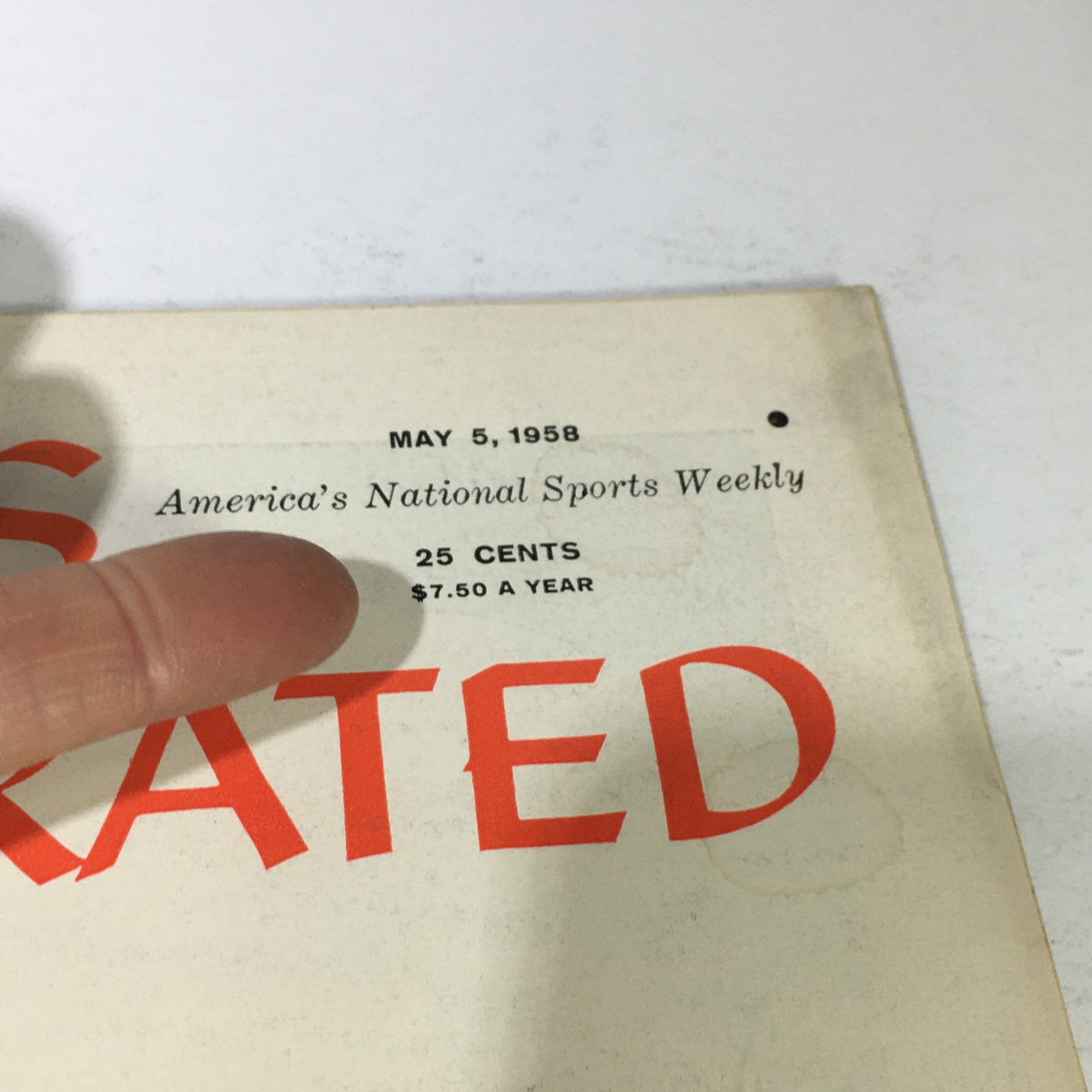Detailed view of the publication date and price on the 'VTG Sports Illustrated Magazine May 5 1958', emphasizing its vintage character.