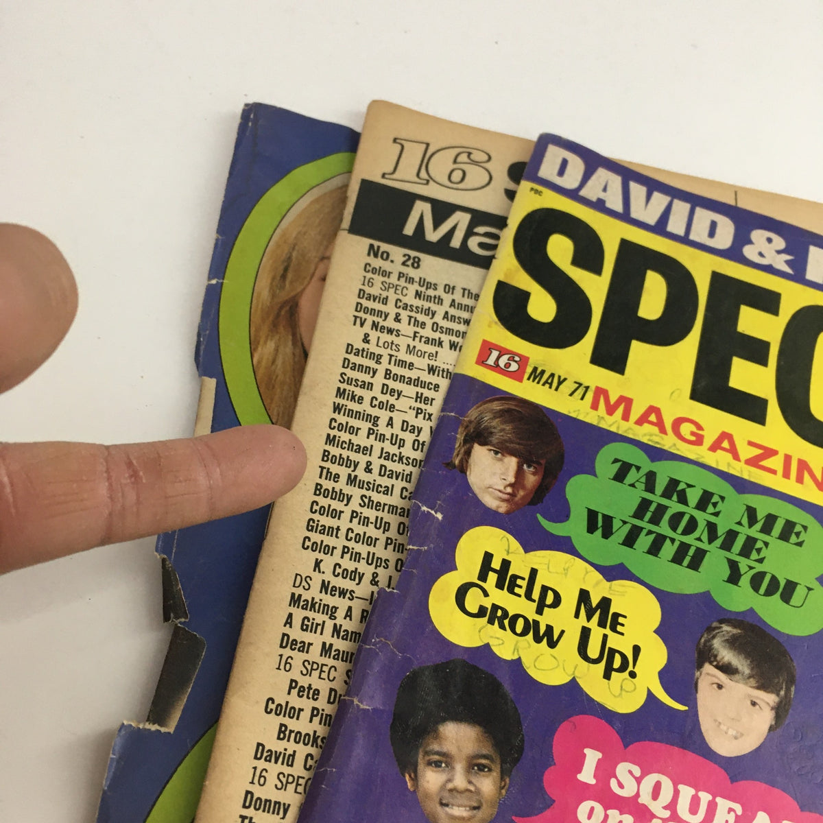 Side view of 16 Spec Magazine May 1971 showcasing the back cover and spine with an emphasis on the vibrant design and images of David Cassidy, Bobby Sherman, and Donny Osmond, highlighting its collectible nature.