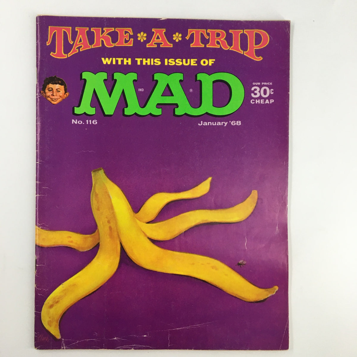 Cover of Mad Magazine January 1968 No. 116 featuring the title 'Take A Trip' with bright yellow bananas on a purple background. A collectible magazine in very good condition.