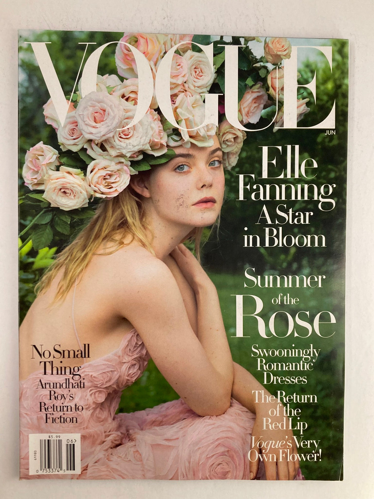 Vogue Magazine June 2017 Cover Featuring Elle Fanning as A Star in Bloom, adorned with flowers, showcasing fashion and beauty trends.