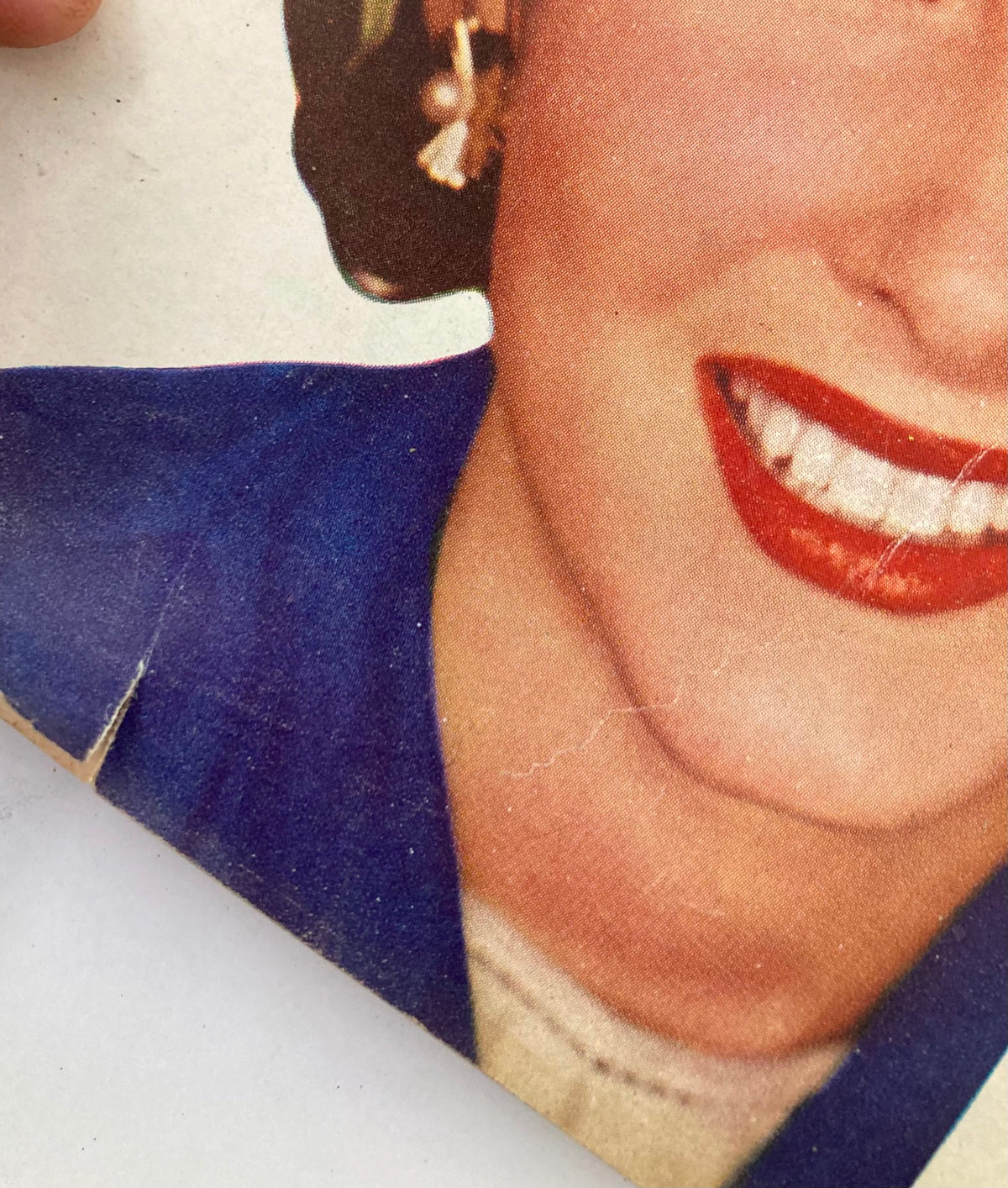 Detail of a smiling woman's face from the VTG Redbook Magazine April 1947 cover, illustrating vintage magazine photography.