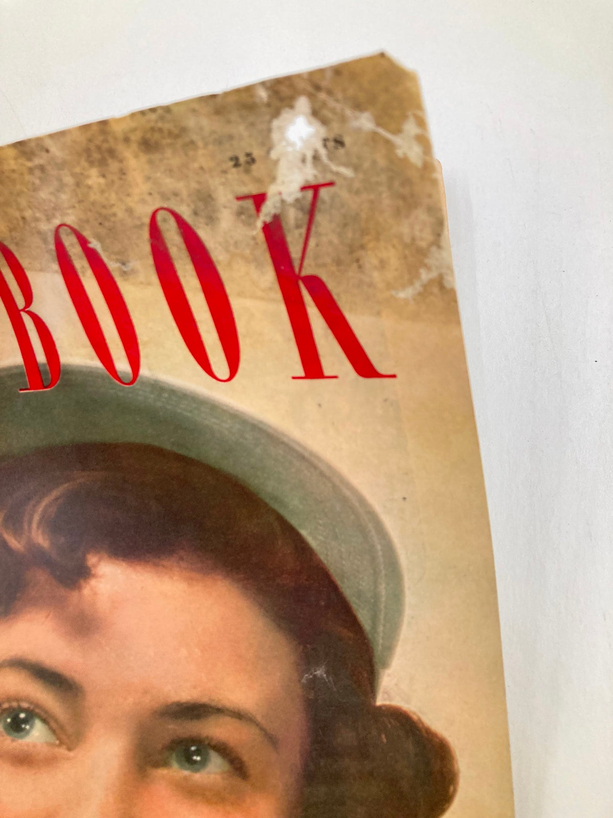 Close-up of the cover of VTG Redbook Magazine June 1949 Volume 93 Issue 2 showing the title and signs of wear.