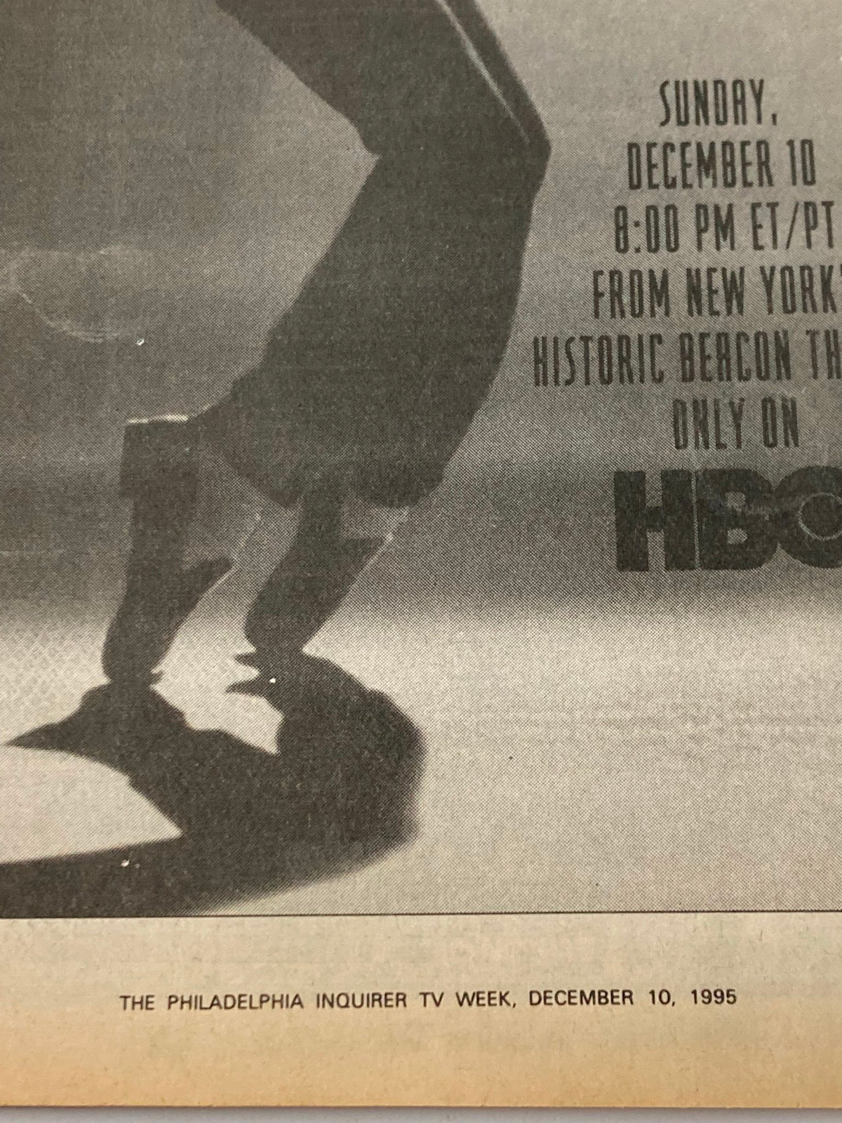 Close-up of vintage magazine page from The Philadelphia Inquirer TV Week December 10, 1995, featuring an advertisement for HBO programming with artistic depiction of a dancer's silhouette.