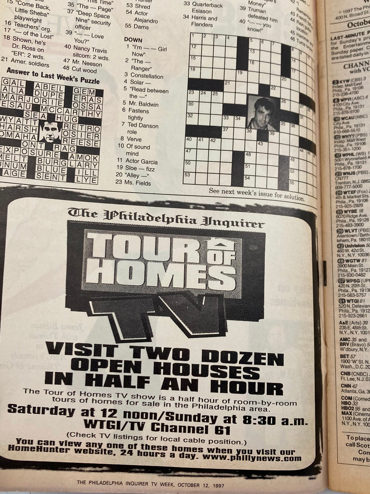 Inside page of The Philadelphia Inquirer TV Week, October 12, 1997, displaying a crossword puzzle and an advertisement for 'Tour of Homes TV', capturing the magazine's vintage charm.