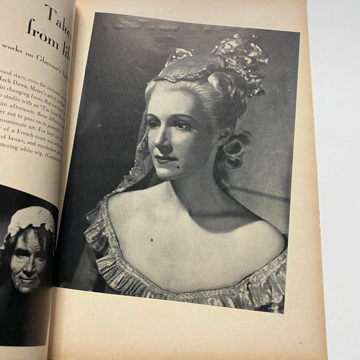 Black and white portrait from GLAMOUR OF HOLLYWOOD Magazine April 1939 featuring a glamorous woman in elegant attire with an elaborate hairstyle.