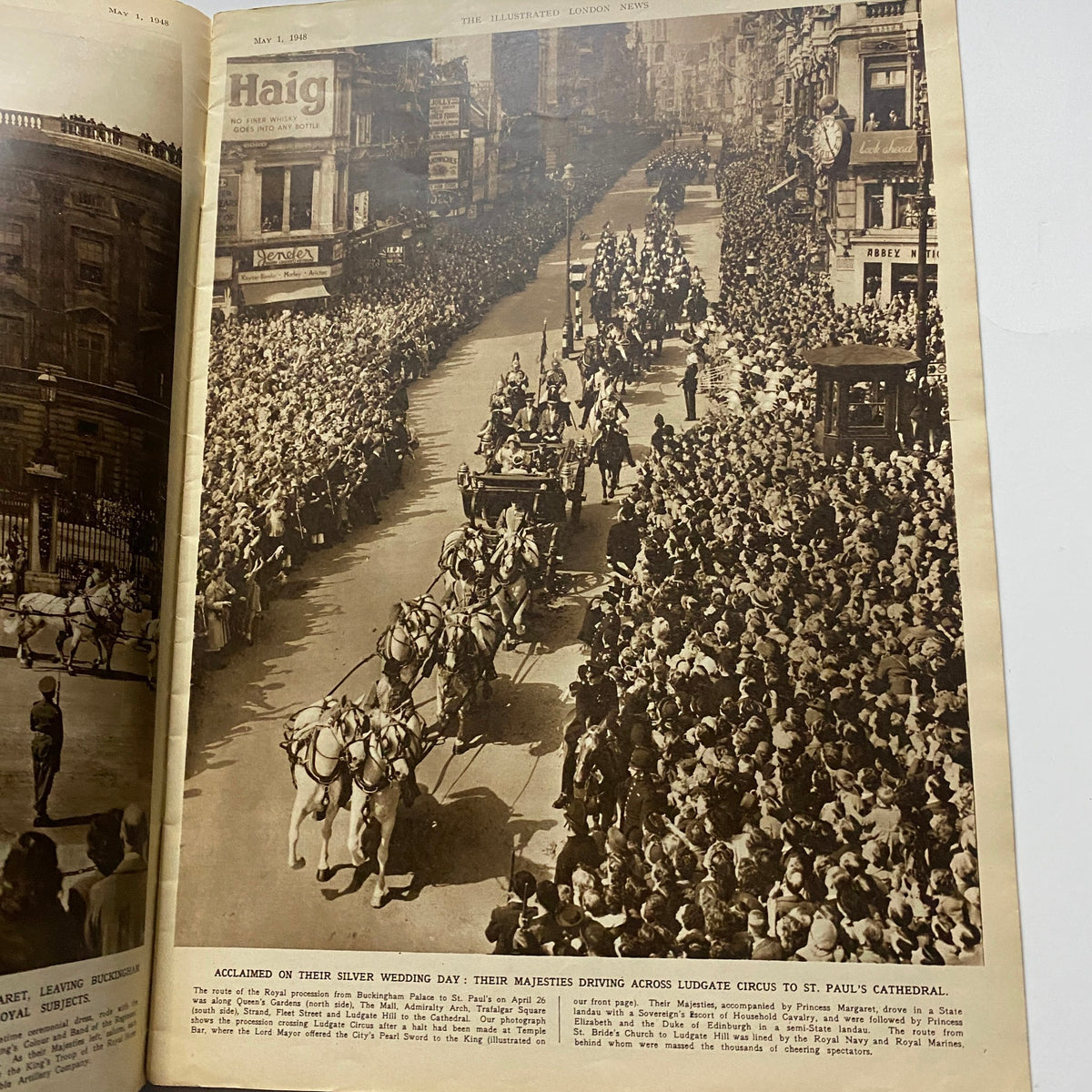 The Illustrated London News May 1 1948 featuring a historical photograph of a royal procession with horses and carriages driving through a crowd gathered to celebrate the Silver Wedding Anniversary of the King and Queen.