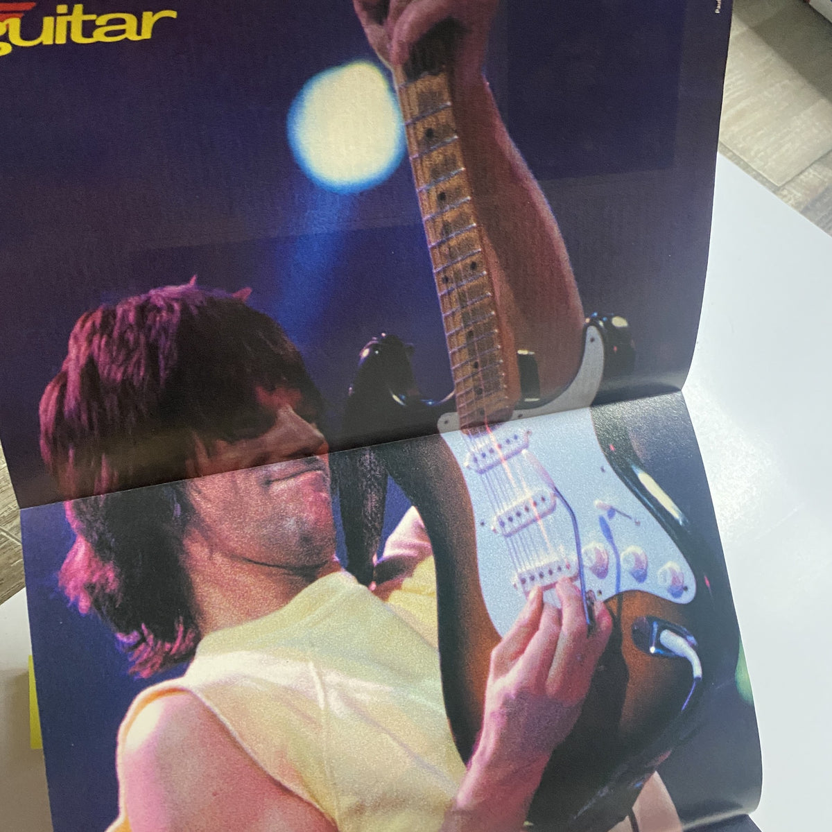 Close-up of an electric guitarist in Guitar for the Practicing Musician Magazine April 1989, demonstrating skill with a focus on their performing style.