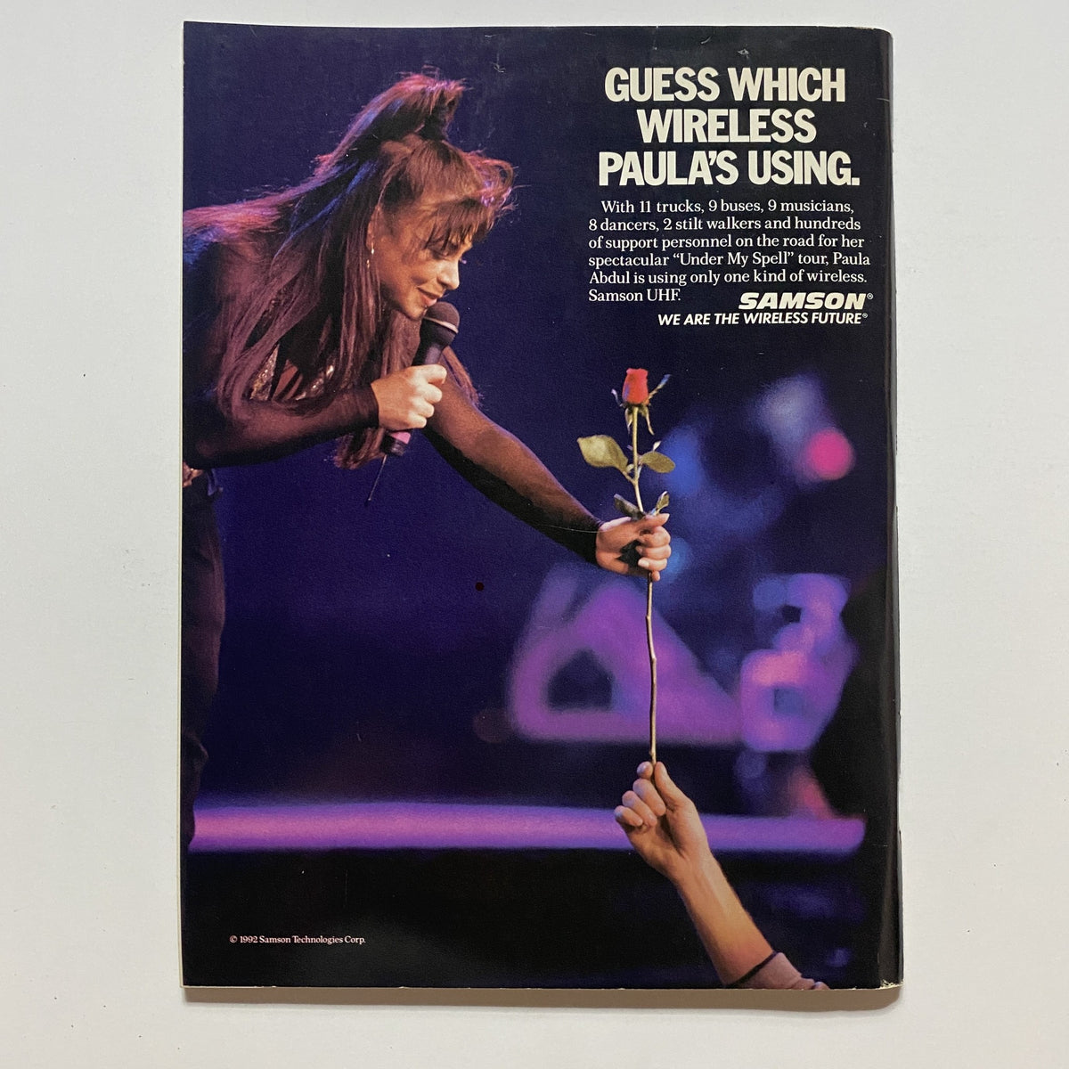 Guitar for the Practicing Musician Magazine April 1992 back cover advertisement for Samson wireless systems, depicting a performer engaged with a microphone and audience interaction.