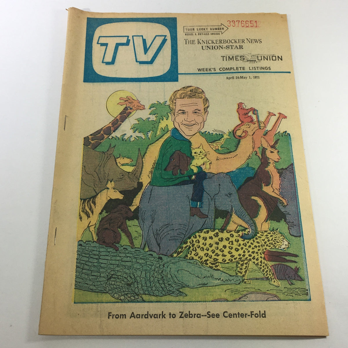 Cover of VTG TV Week's Complete TV Listings April 24-May 1 1967, featuring an illustration with animals like a giraffe, elephant, and leopard, alongside a smiling man, reflective of vintage television culture.