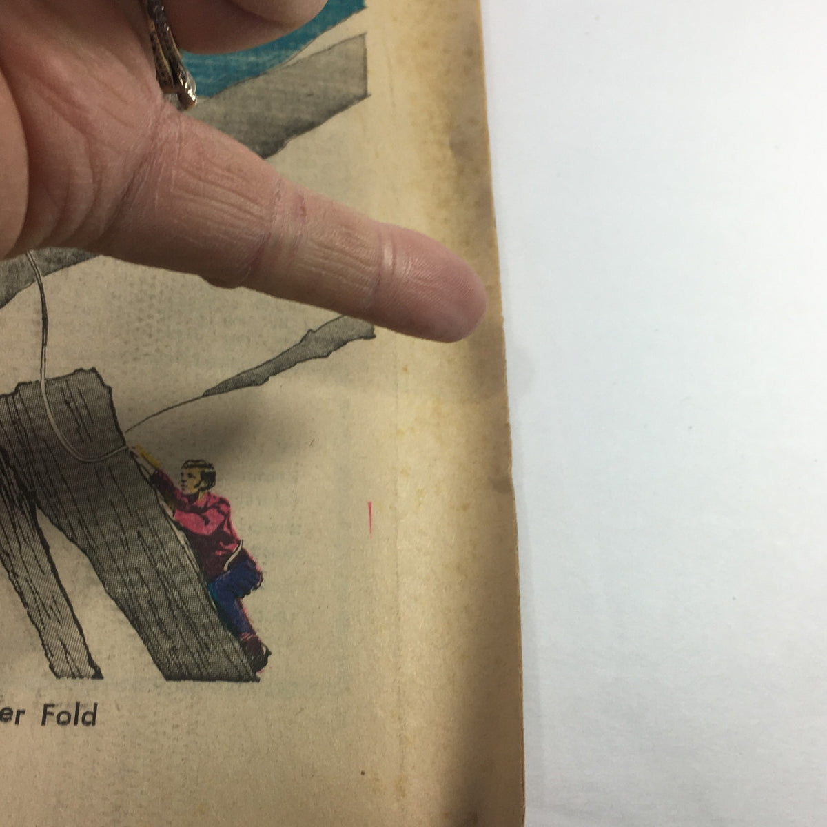 Illustration from VTG TV Week's Complete TV Listings May 2-9 1970, depicting a climber on a rocky terrain, part of the magazine's vintage design.
