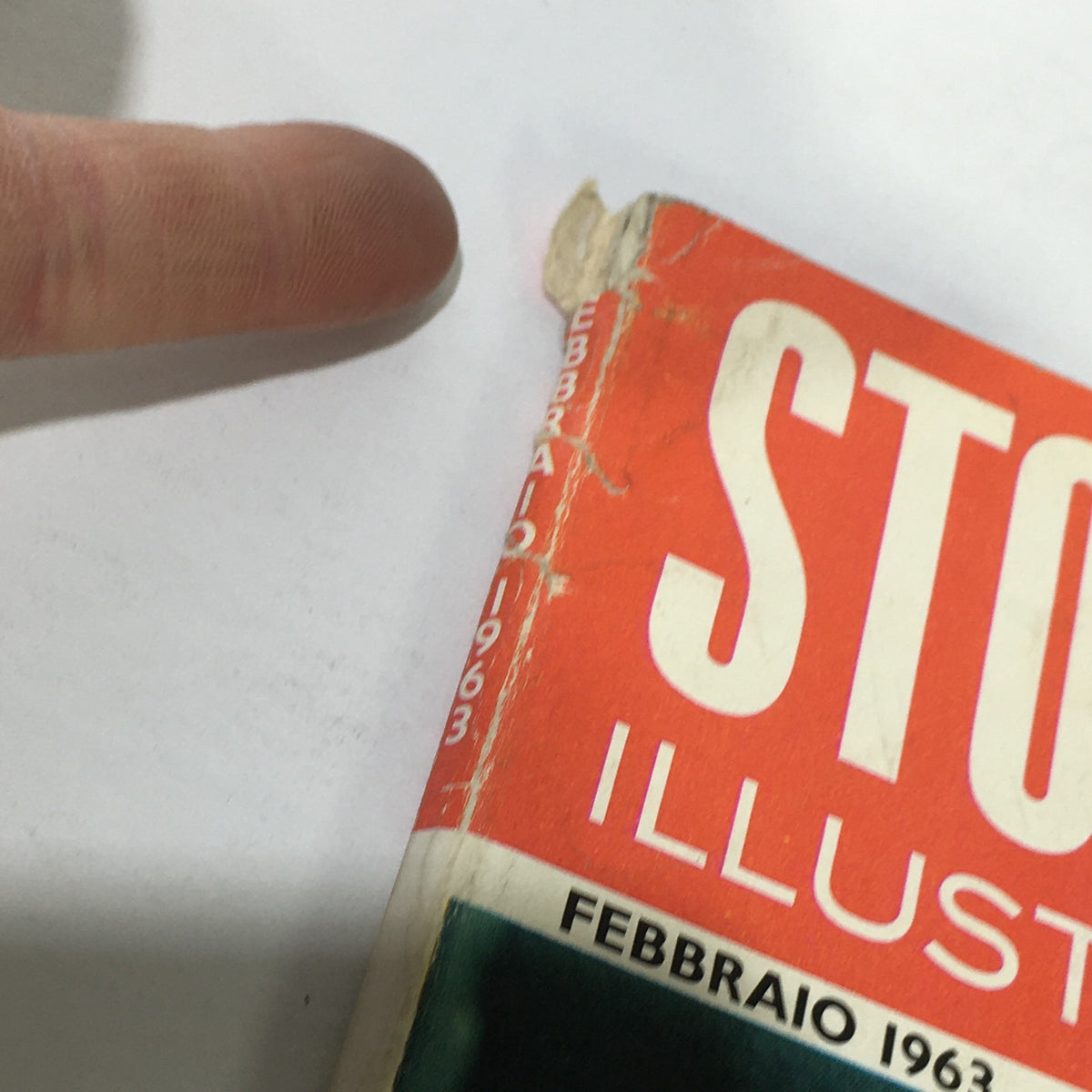 VTG Storia Illustrata Magazine February 1963 showing the magazine's spine with wear and tear, emphasizing its vintage character and historical significance.