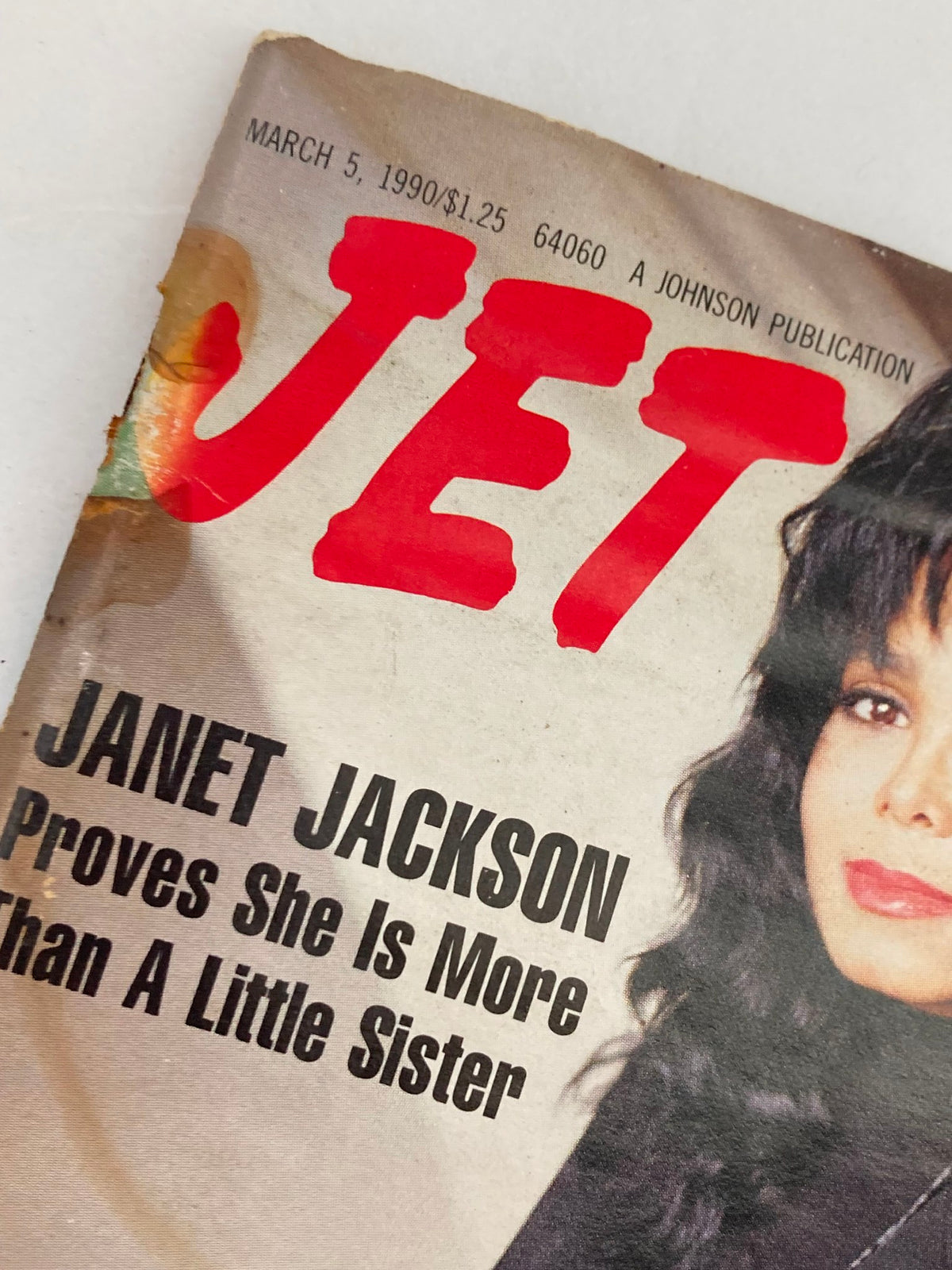 Close-up of the cover of Jet Magazine, March 5, 1990, Vol 77 #21, with Janet Jackson on the front, emphasizing her role in music and culture during the early 1990s, featuring the tagline 'Proves She Is More Than A Little Sister'.