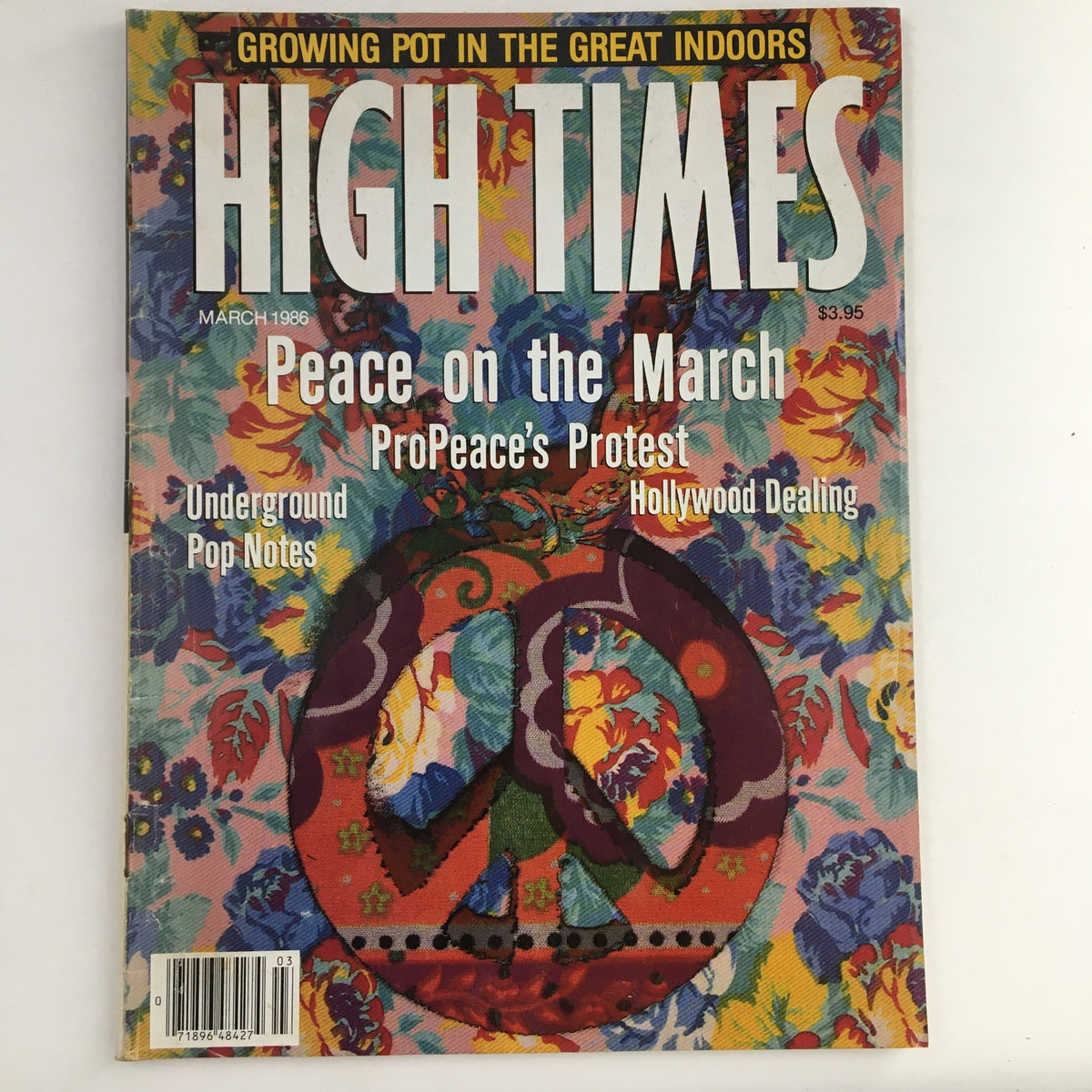 Cover of High Times Magazine March 1986 featuring the main title 'Peace on the March' and the subheading 'Growing Pot in the Great Indoors', showcasing a colorful floral design and a peace symbol.