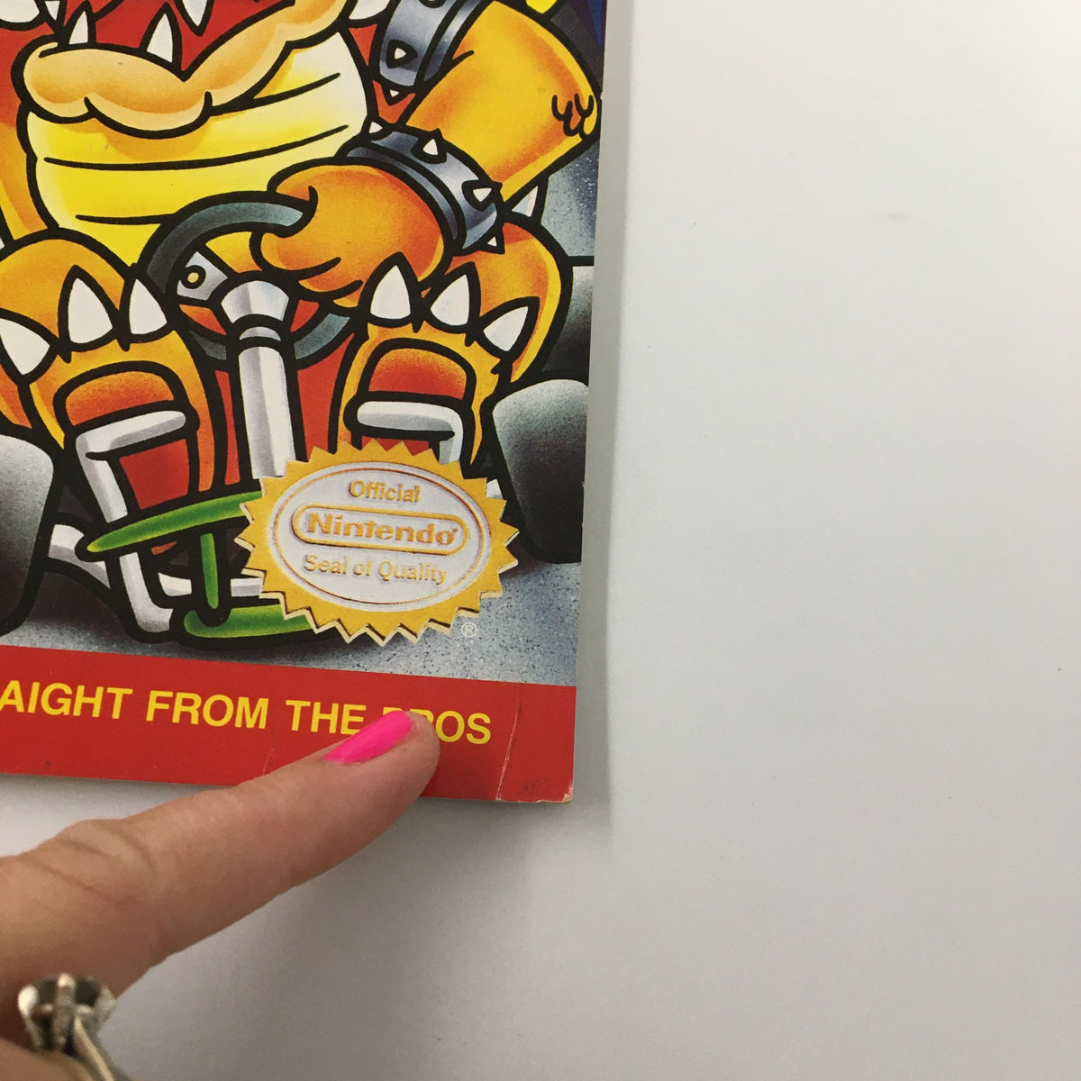 Close-up of the cover of Nintendo Power Magazine, October 1992, Issue #41 showcasing Bowser and the official Nintendo Seal of Quality, perfect for gaming nostalgia.