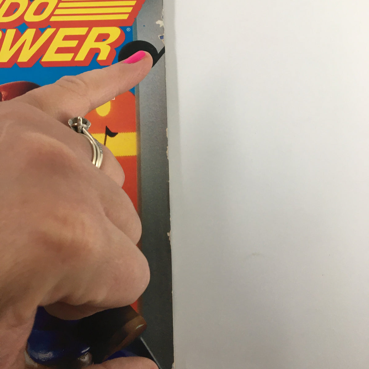 Close-up of the edge of Nintendo Power Magazine August 1992, Issue #39, highlighting minor wear and detailing on the cover.