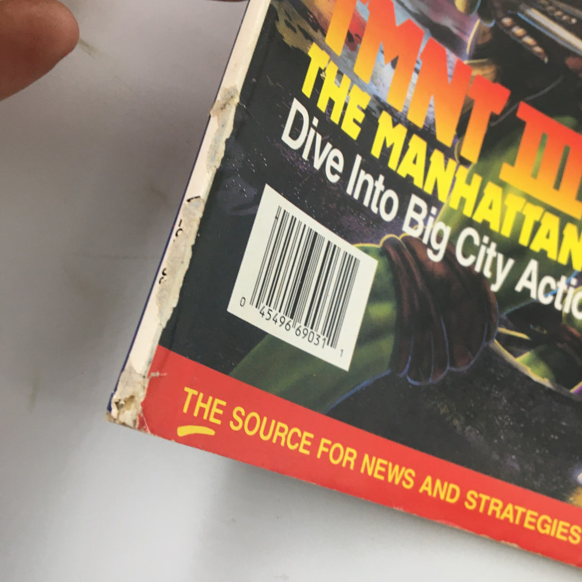Side view of Nintendo Power Magazine February 1992 #33 TMNT III The Manhattan Project showing minor wear and the magazine's barcode.