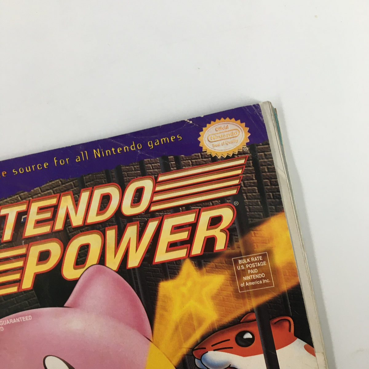 Top corner view of Nintendo Power Magazine May 1995, Issue #72 displaying the official Nintendo seal of quality and Kirby's Dreamland 2.
