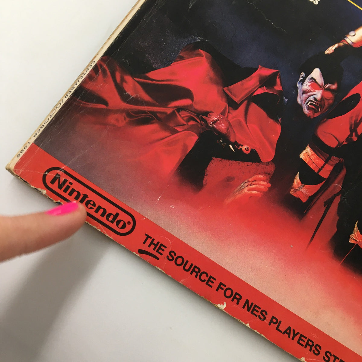 Close-up of the Nintendo logo and part of the cover design from the Nintendo Power Magazine September 1988, showcasing Castlevania II: Simon's Quest theme.