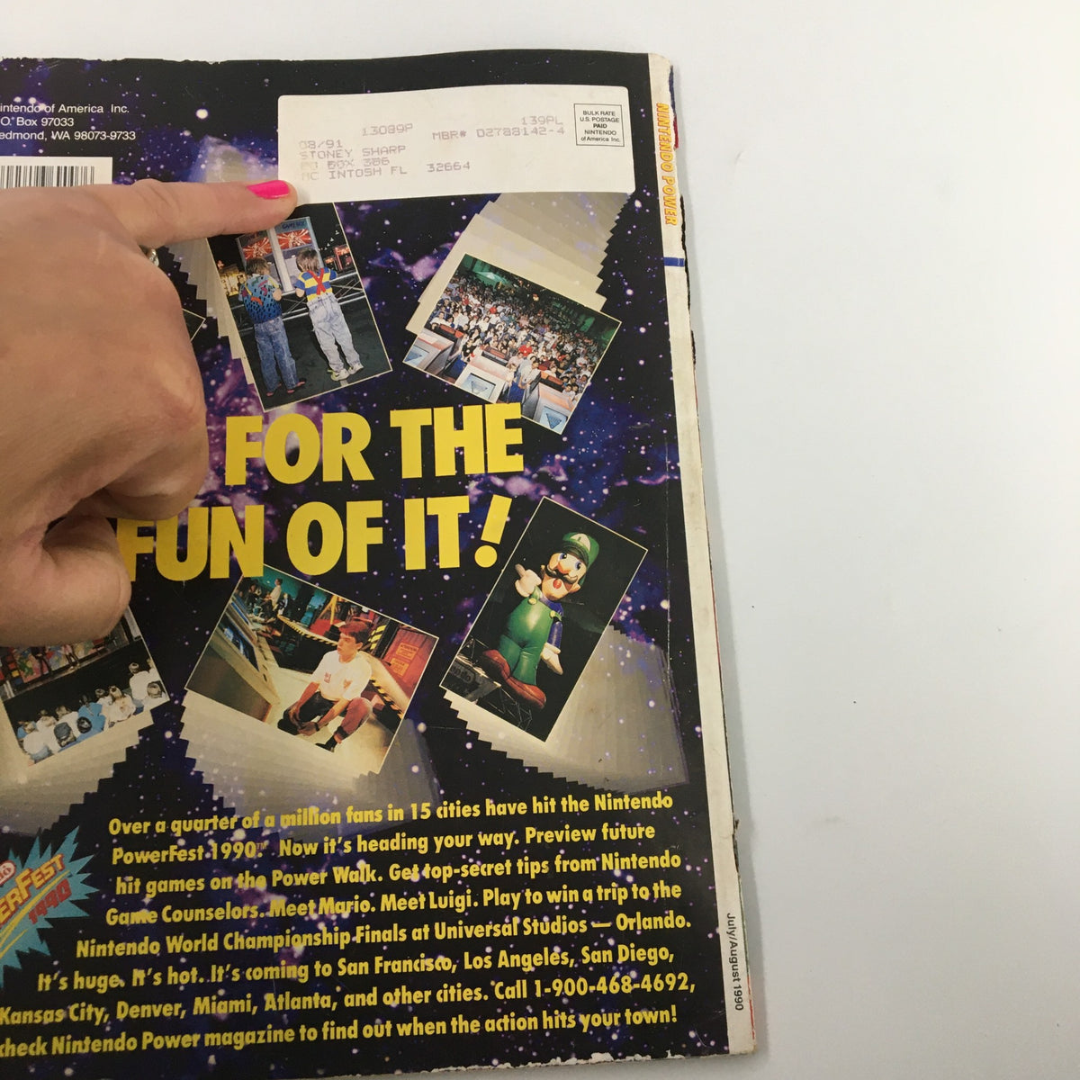 Back cover of Nintendo Power Magazine July 1990, displaying information about the Nintendo Powerfest 1990 event with various Nintendo characters.