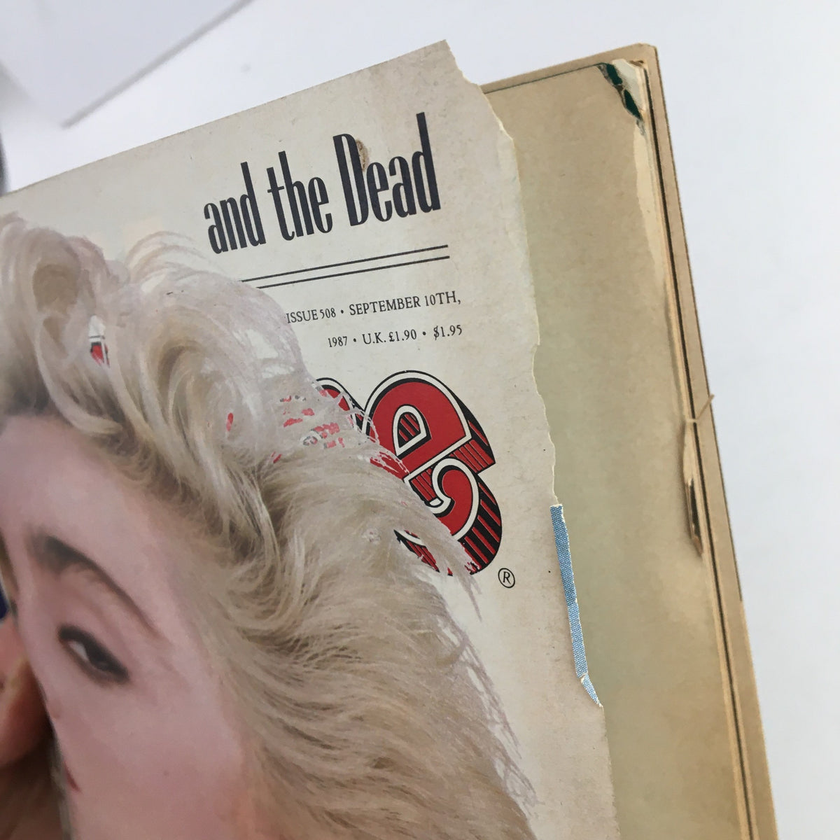 Close-up of Rolling Stone Magazine September 10, 1987, issue featuring Madonna on the cover with visible wear and tear, highlighting its vintage condition.
