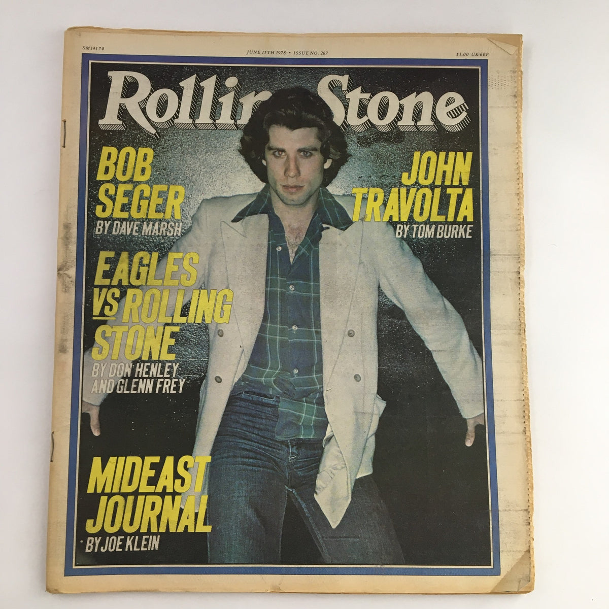 Rolling Stone Magazine cover from June 15, 1978 featuring John Travolta in a stylish outfit and Bob Seger. This vintage magazine highlights key figures in music and film from the late 1970s, making it a collectible item for pop culture enthusiasts.