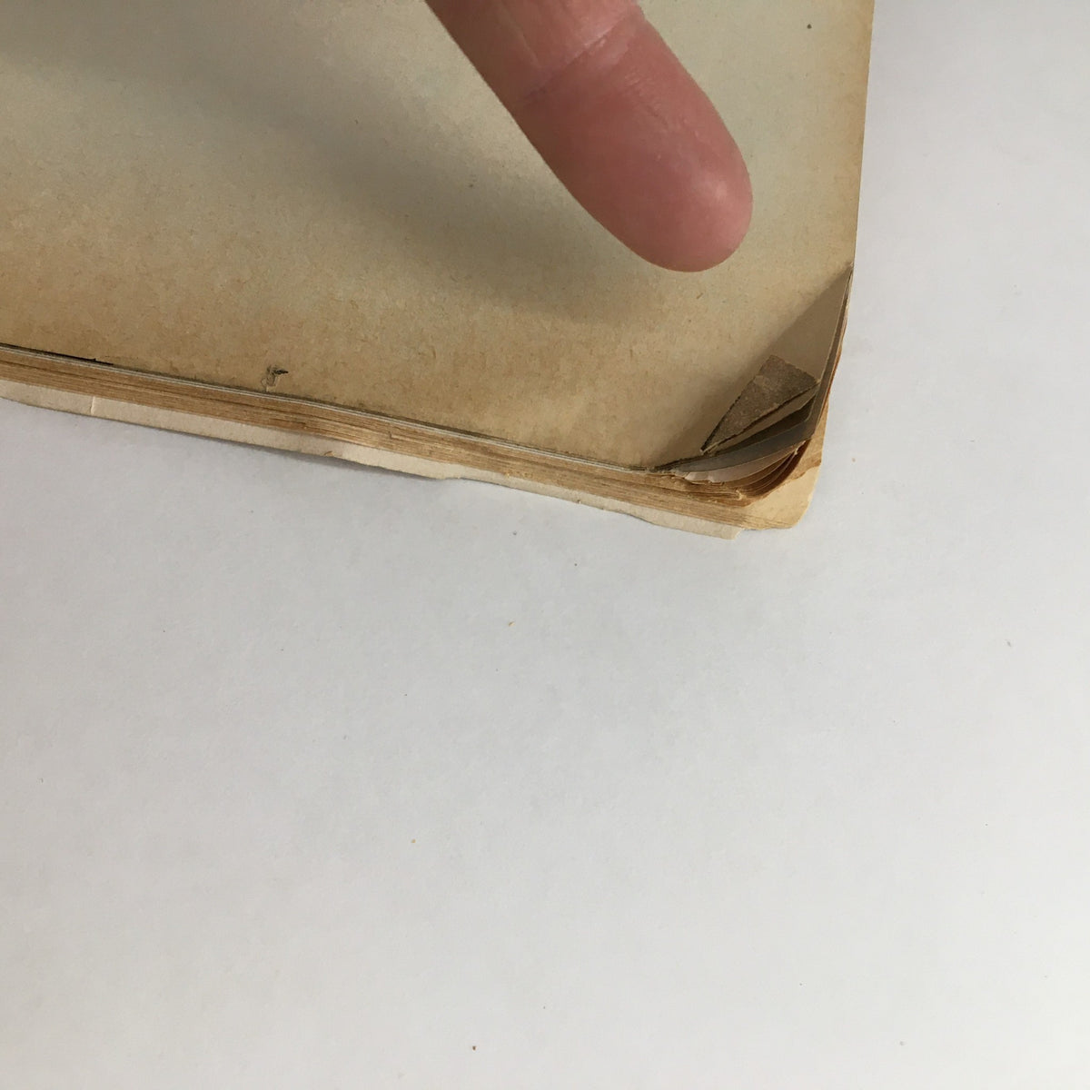 Close-up of the corner of the February 1953 Photoplay Magazine showing wear, indicative of its vintage condition.