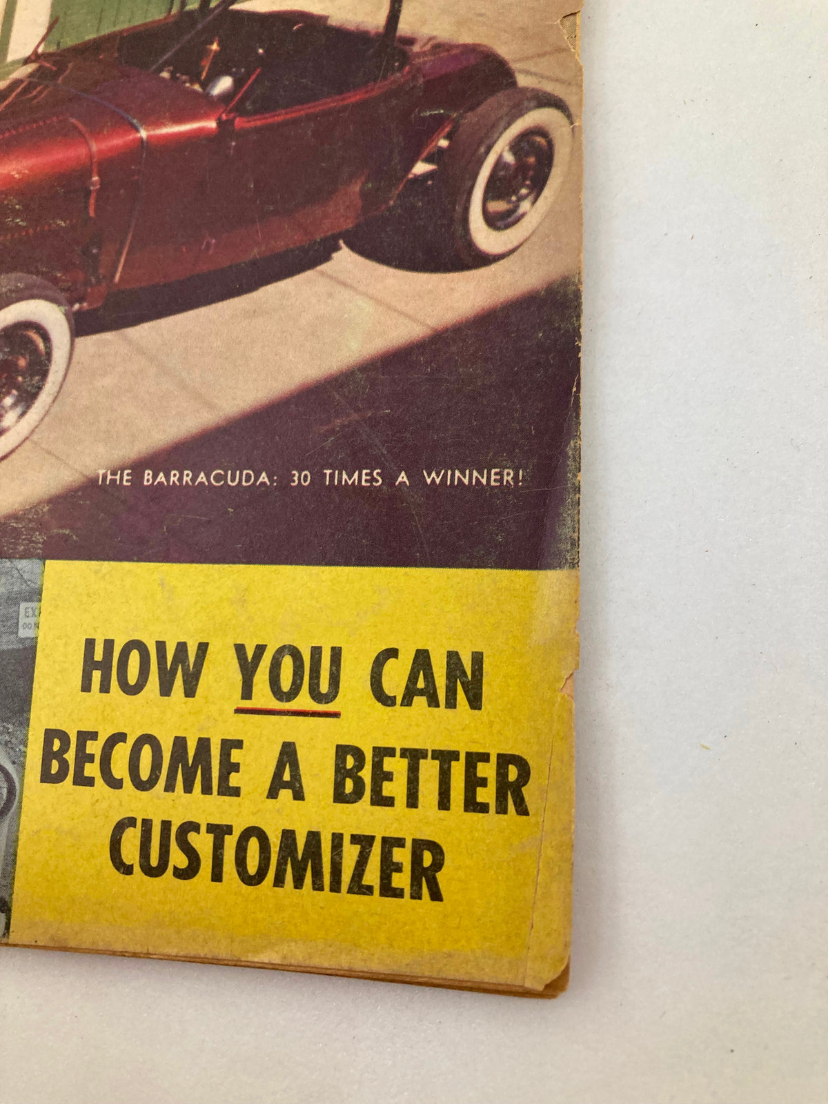 Close-up of the VTG Custom Rodder Magazine February 1958 highlighting the phrase 'How You Can Become a Better Customizer' with a classic custom car featured.