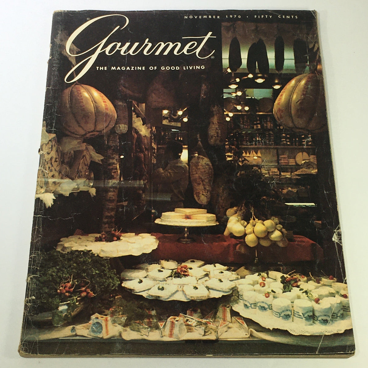 Cover of VTG Gourmet The Magazine of Good Living November 1970 showcasing a vintage food display with cheeses, fresh produce, and an inviting ambiance.