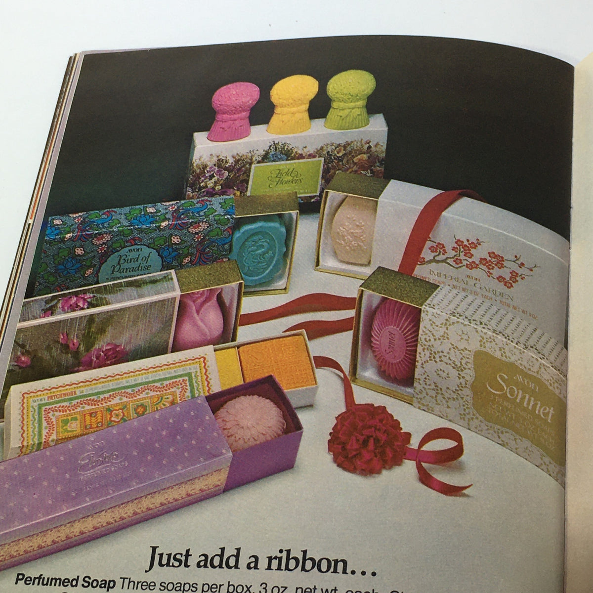 Vintage Avon Christmas Price Guide Product Catalog December 1974 displaying beautifully packaged perfumed soap sets and gift options.