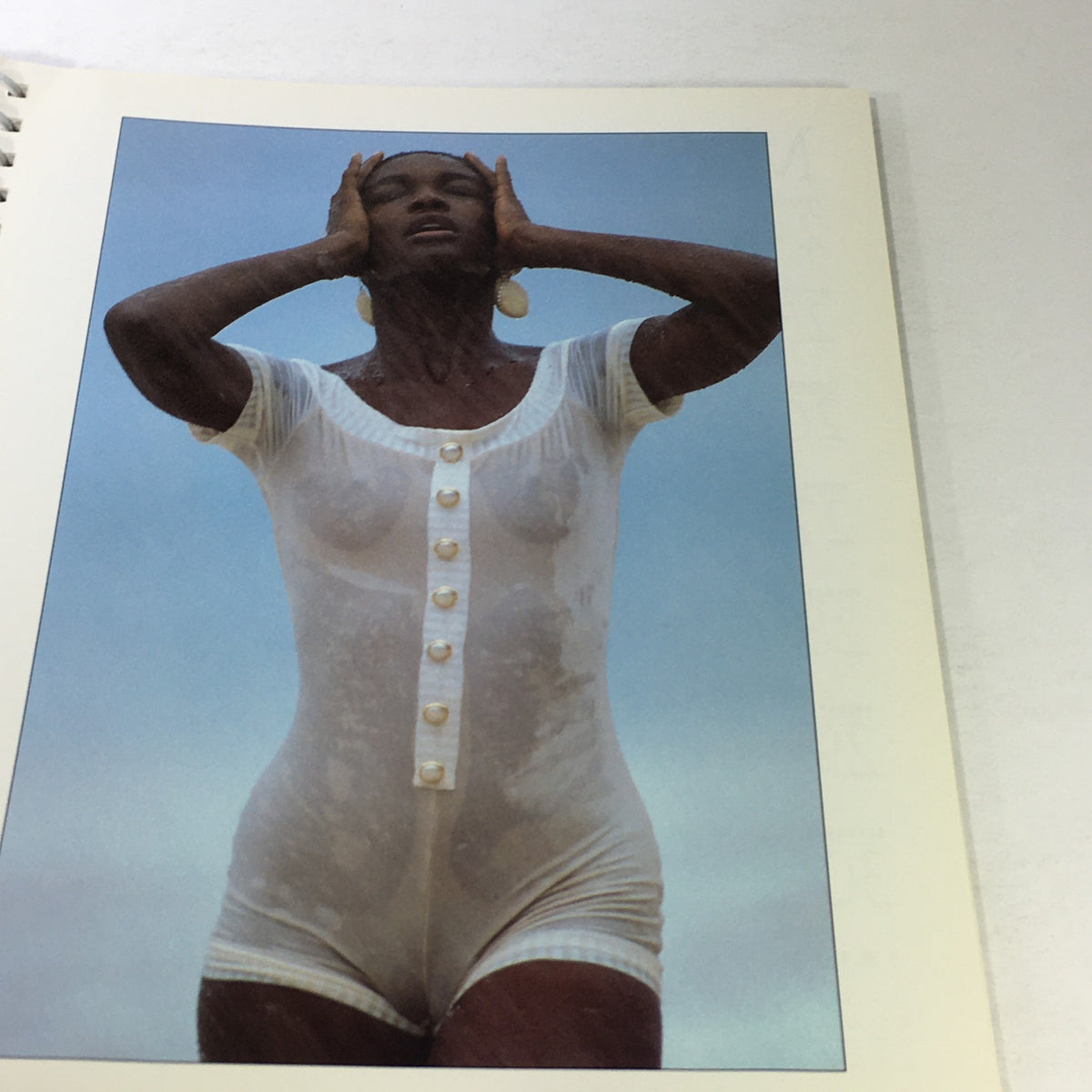 Sports Illustrated 1992 Swimsuit Desk Calendar featuring a model outdoors, showcasing a transparent outfit, highlighting the vintage swimwear aesthetic.