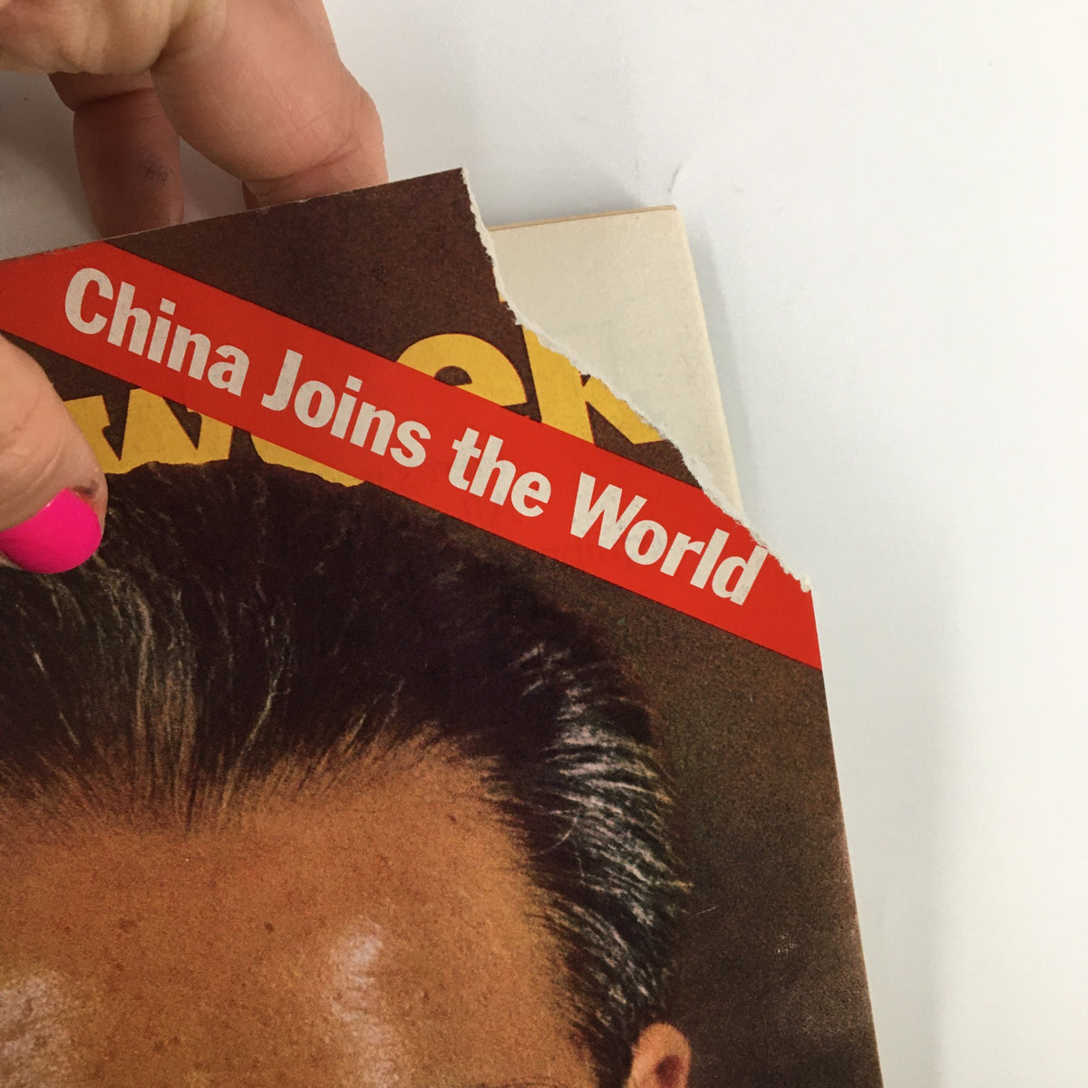 Close-up view of the VTG Newsweek Magazine November 8 1971 cover, showing the tearing edge with the text 'China Joins the World,' an important piece of history related to Chou En-Lai.