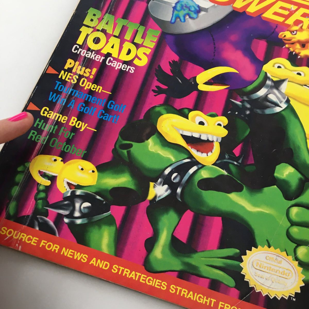Close-up of the front cover of Nintendo Power Magazine June 1991 #25 with detailed focus on the title Battle Toads Croaker Capers.