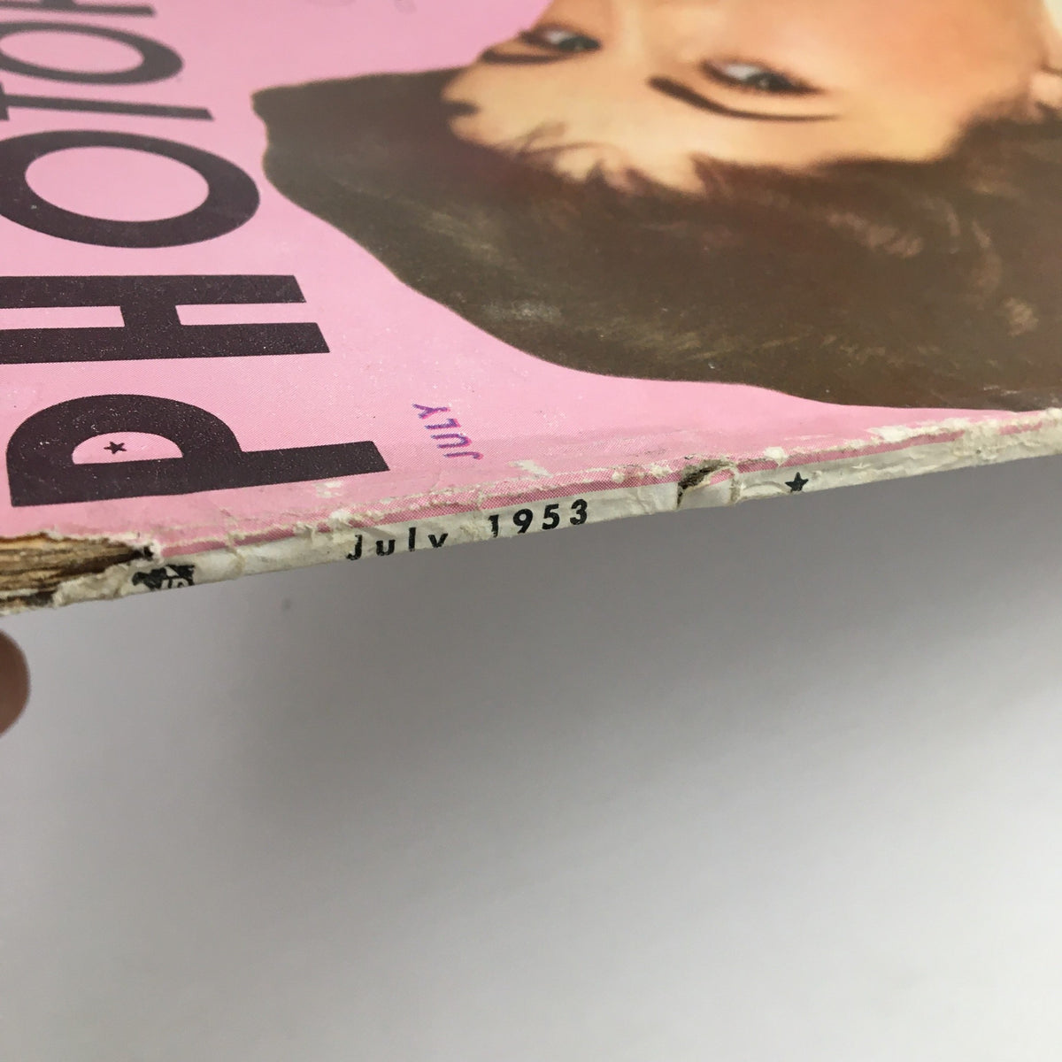 Side view of Photoplay Magazine July 1953 showing the spine and publication date, highlighting its vintage condition.