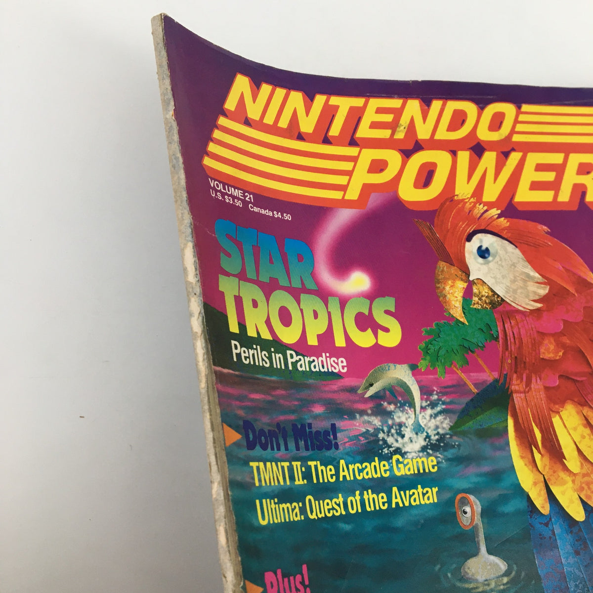 Top corner of Nintendo Power Magazine February 1991 #21 showing the title Star Tropics Perils in Paradise and additional game features highlighted.