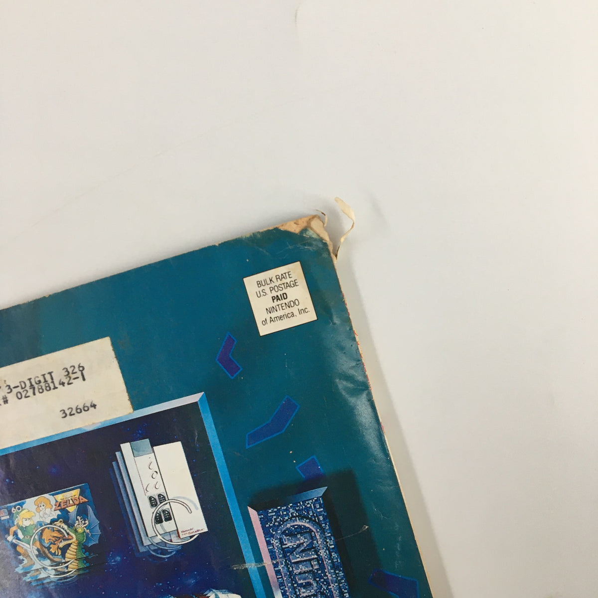 Close-up of the back cover of Nintendo Power Magazine January 1991 Issue #20 with address correction label and various Nintendo product images.