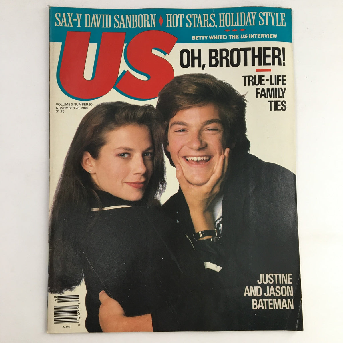 Cover of US Magazine November 28, 1988 featuring Justine and Jason Bateman. The magazine highlights the theme 'Oh, Brother! True-Life Family Ties.' It showcases the Bateman siblings in a playful pose, emphasizing their connection.